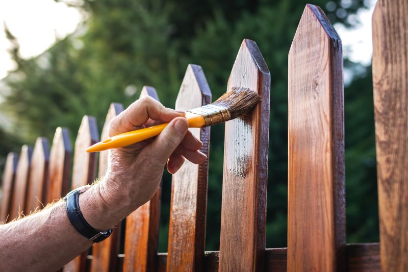 Local Cedar Fence Painting pros at work